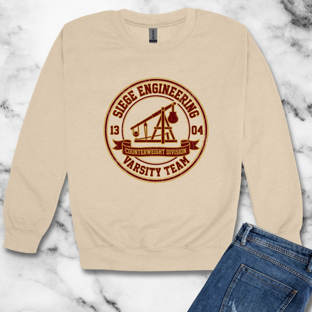 Trebuchet Varsity Team  Unisex Heavy Crewneck Sweatshirt