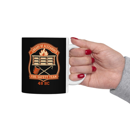 Library Alexandria Fire Safety ceramic mug, 15oz, held in hand