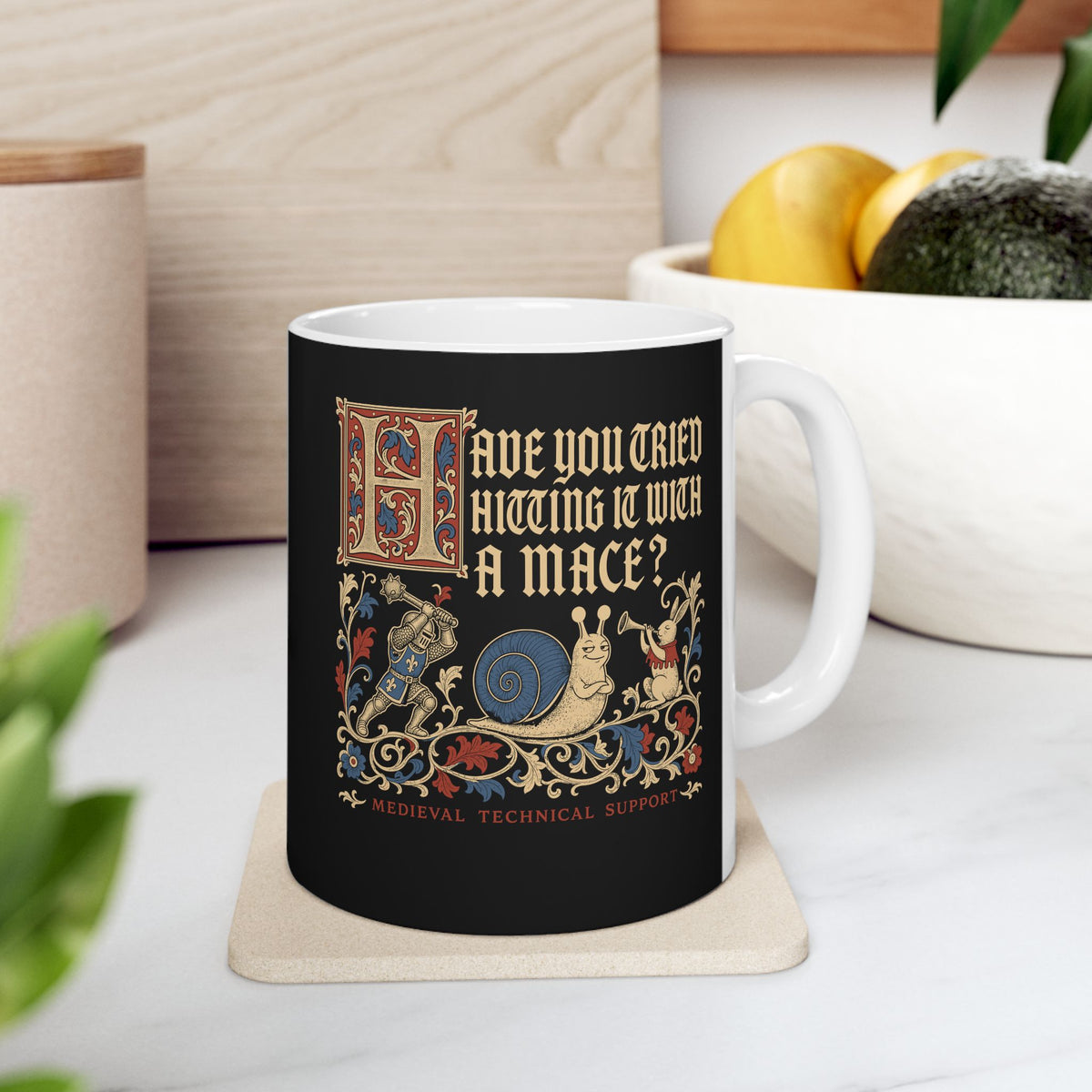 Medieval Technical Support Knight Snail Mace ceramic mug, 11oz, on a kitchen counter