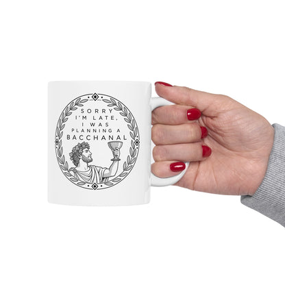 Planning a Bacchanal ceramic mug, 15oz, held in hand