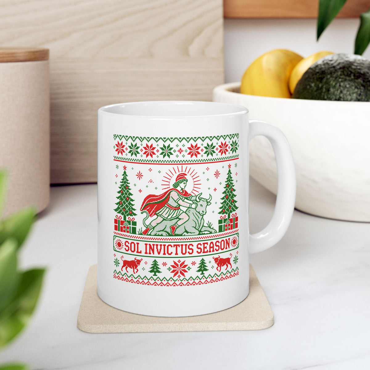 Sol Invictus Season Ugly Sweater Style ceramic mug, 11oz, on a kitchen counter