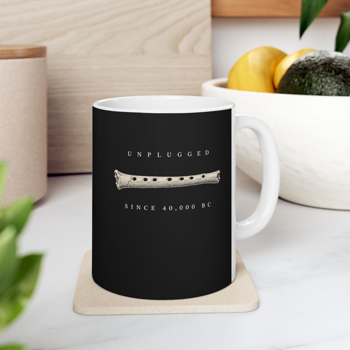 Unplugged Since 40,000 BC Hohle Fels Flute ceramic mug, 11oz, on a kitchen counter